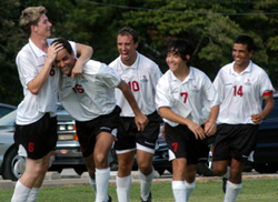 8/29/2003 - Duncan Nicol (6) and other teammates congratulate Alexandre Pereira (16) after one of his goals. (ID: 1408)