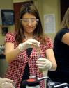 A student works on a biology lab experiment.  - Photo by Morris Abernathy