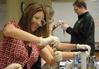 Students work on a biology experiment in lab.  - Photo by Morris Abernathy
