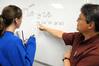 4/26/10 - Dr. Troy Riggs, professor of mathematics, helps a student with a math problem. - Morris Abernathy