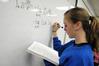 4/26/10 - Students in Dr. Troy Rigg's math class write homework problems on the board before class.  - Morris Abernathy