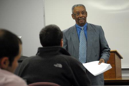 Dr. Roland Porter, associate professor of business, teaches a class. 