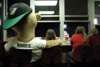 Ribbee, the team mascot, and some of the Diamond Jaxx fans take a couple moments to relax and savor the baseball game together.  The overlook from one of the suites provides the perfect view of the evening ballgame held on Friday, Aug. 29. - Photo by Justin Veneman