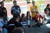 Faculty and students listen to English majors present their semester long projects outside Barefoots Joe for the annual scholarship symposium. - Photo by Morris Abernathy