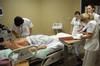 Nursing students work on simulations in Providence Hall. - Photo by Morris Abernathy