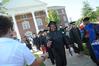 7/31/10 - Graduates reach for cold bottles of water to beat the heat at summer graduation. 