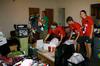 Jordan Float, Rebecca Eaton, Kirby Lewis, and Emily Alm help new students move their things into the dorms on Move In Day.  - Photo by Ebbie Davis
