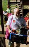 Joe Harrison, associate professor of management, helps new students with their boxes on Move In Day. - Photo by Ebbie Davis