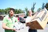 Lee Wilson, director of discipleship, and Landon Preston, director of donor relations, help a new student move into the dorms on Move In Day. - Photo by Deanna Santangelo