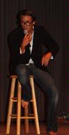 Micah Roeder, focus leader, entertains the new students at the annual Focus Show by performing in a skit as a game show host. - Photo by Ebbie Davis