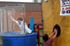 Senior DMS Major Justin Veneman is dunked by Missionary in Residence Tommy and Nancy Tucker's son Zachery. - Photo by Jonathan Blair