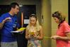 International Focus Leader Martin Godwin, sophomore physical education and health major, gives instructions to new Union student Julianne Kirchner and her mother, Judy.  - Photo by Victoria Stargel