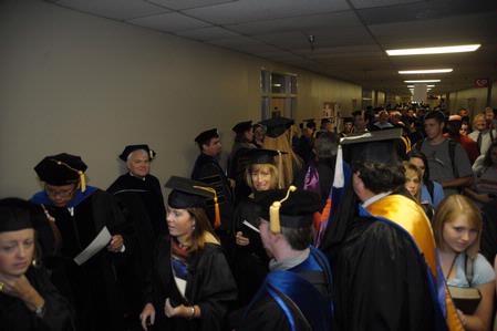 Faculty, staff, and students fill the hallway of the Penick Academic Complex before Fall Convocation.