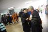 President David S. Dockery greets James Huggins, university professor of biology, after the Fall Convocation service.  - Photo by Morris Abernathy