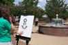 Besty Marsch, freshman art major, participates in a drawing assignment during an outdoor art class. - Photo by Ebbie Davis