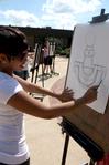 Alesia Fisher, freshman art major, draws the fountain during drawing class outside on a beautiful day. - Photo by Ebbie Davis