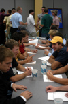 A group of rushees visit with one another during the Inter-Fraternity Council's open party. The IFC party is the official start to guys' rush. - Photo by Jonathan Blair
