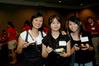 Ming Tay, junior broadcast journalism major, May Lee, junior nursing major, and Kendra Loh, freshman psychology major, eat their desserts together at the SGA/President's Reception. - Photo by Deanna Santangelo