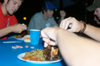 Rushees at the Alpha Tau Omega party are treated to tasty chicken. Meals are served throughout rush. - Photo by Jonathan Blair