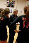 Kelly Elliot, head coach, talks with the volleyball team during a time out in a match against Lyon College. The Lady Bulldogs won 3-1.  - Photo by Deanna Santangelo