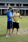 Wade Evans, junior physical education and health major, and Justin Boggs, junior nursing major, get ready to practice their archery skills at the Watters Great Outdoors event.  - Photo by Deanna Santangelo