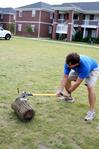 Aaron Daigle, senior social work major, tests out the freshly sharpened axe before the games begin at the Watters Great Outdoors competition.
 - Photo by Deanna Santangelo
