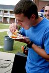 Casey Kidd, senior Christian studies major, eats as many pancakes as he can for his team during the Watters Great Outdoors competition. - Photo by Deanna Santangelo