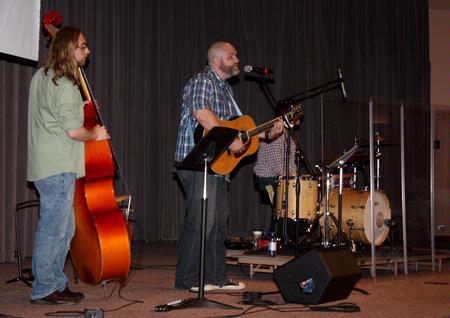 A group from City Fellowship, led by pastor Russ Pflasterer, leads music during chapel.