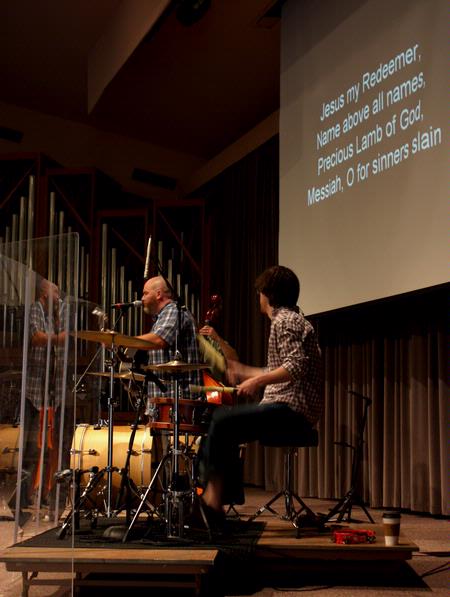 A group from City Fellowship, led by pastor Russ Pflasterer, leads music during chapel.
