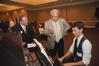 Larry Vaughn, assistant to the senior vice president of university relations, and Dennis Swanberg talk to Sam Ritter, junior music major, before the West Tennessee Pastors Appreciation Banquet. - Photo by Morris Abernathy