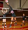 09/252/10 - Marcela Madeira spikes the ball over the net during a game against Martin Methodist, which the Lady Bulldogs won 3-1