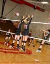 09/9/10 - Ana Sims and Caroline Robbins jump to block the ball against Martin Methodist. The Lady Bulldogs won 3-1.