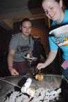 Liz Waggoner, freshman chemistry major, and Sara Masters, sophomore social work major, roast marshmallows during Residence Life's progressive snacking event.  - Photo by Victoria Stargel