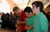 Joey Davis, freshman, gathers with other Union students for prayer during GO Week chapel. - Photo by Ebbie Davis