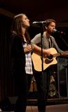 Natalie Wittman, junior English major, and TJ Hester, junior philosophy major, lead students in music at a Global Outreach chapel. - Photo by Ebbie Davis