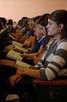 Students follow along in their Bibles during GO Week chapel lead by J.D. Greear, lead pastor of The Summit Church in Durham, NC. - Photo by Ebbie Davis