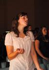 Jenny Voss, freshman applied linguistics major, sings along to "It is Well" during a chapel service. 
 - Photo by Victoria Stargel