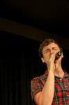 Sidney Burngasser, sophomore music education major, sings a solo with the group "On Holidays." This group performed various songs about summertime and were ultimately the winners of the competition. - Photo by Deanna Santangelo