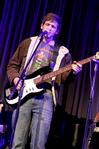 Rob Griffith, freshman English major, performs with the band Flying Colours during All-Sing.  - Photo by Deanna Santangelo
