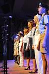 The women of Chi Omega perform their small group number for All-Sing. Their Independence Day medley brought the crowd to their feet for "The National Anthem" and drew tears as members of the Armed Forces stood for their respective anthems during the "Armed Forces Medley." - Photo by Victoria Stargel