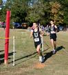 Drake Ott, sophomore athletic training major, and Logan Smith, sophomore, run in a cross country race.  - Photo by Deanna Santangelo