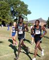 Alex Bett, junior computer science major, and Edwin Kurgat, freshman business administration major, finish up a cross country race. - Photo by Deanna Santangelo