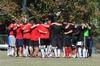 Union soccer alumni huddle with the bulldog jv soccer team before playing a game against each other.  - Photo by Victoria Stargel