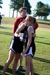 10/275/10 - Carissa Wilson, senior elementary education major, hugs her teammate after a cross country meet. 