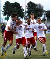10/275/10 - The Bulldogs celebrate a goal by Dejan Kostic (second from left) in a game against Mid-Continent University. 