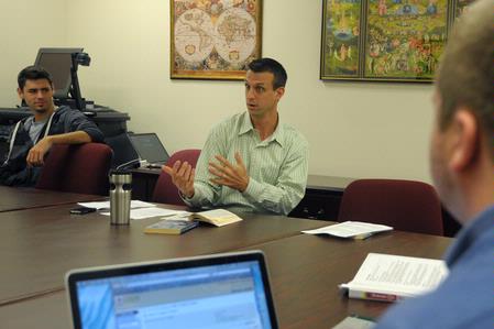 Roman Williams, assistant professor of sociology, teaches a class. 
