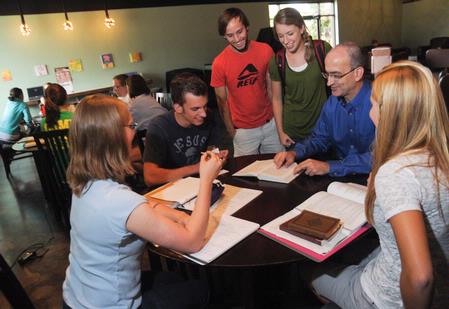 George Guthrie (second from right), Benjamin W. Perry Professor of Bible, holds a discussion with students in Barefoots Joe. 