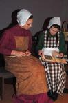 Allison Hearn, freshman business administration major, and Sarah Love, freshman Biblical studies major, play new members of the Shaker community busying themselves with "Shaker" pastimes in the Fall play, As It Is In Heaven.   - Photo by Victoria Stargel
