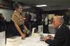 Dr. Daniel Walker Howe, Pulitzer Prize-winning author, visits with Kate Cline, senior history major, as he signs her copy of his book, <em>What Hath God Wrought</em>. Howe presented a lecture for the annual Carls-Schwerdfeger History Lecture Series.  - Photo by Victoria Stargel