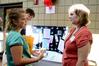 Hannah Mahoney, sophomore nursing major, talks to Danielle Lampley, alum and representative for W.R.A.P., at Career U, hosted by Career Services.  - Photo by Deanna Santangelo